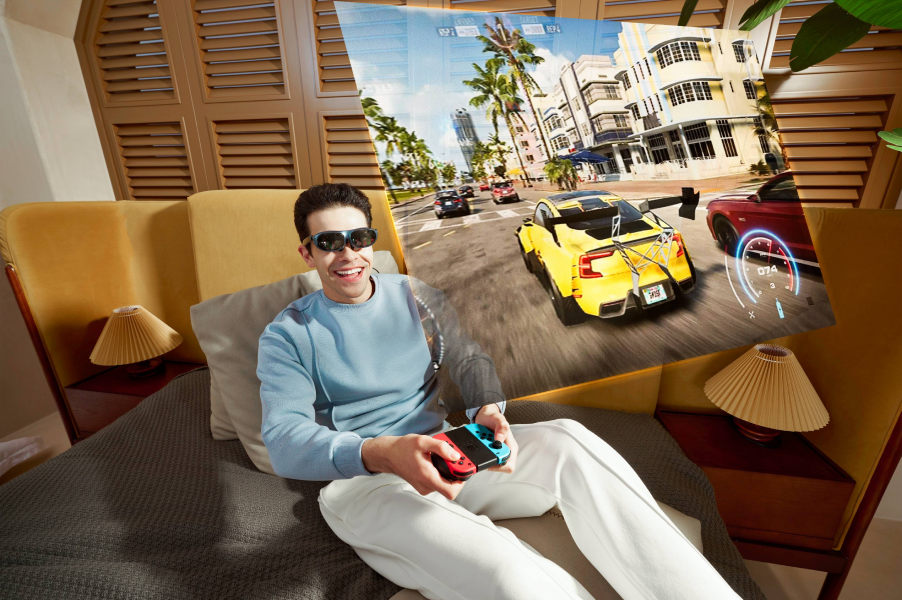 A man using Rokid AR glasses for gaming