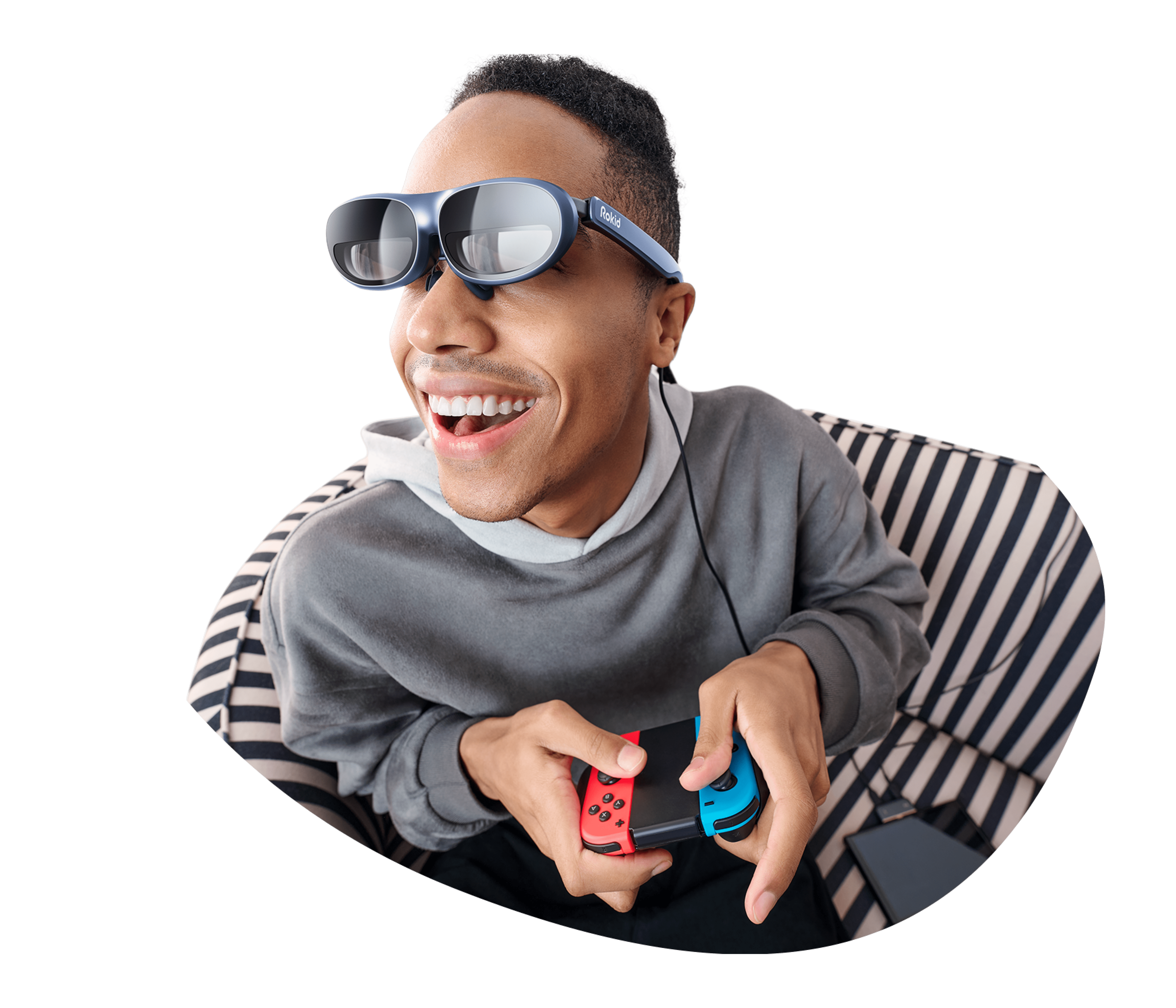 A man wearing Rokid MAX AR glasses to play games on Steam Deck