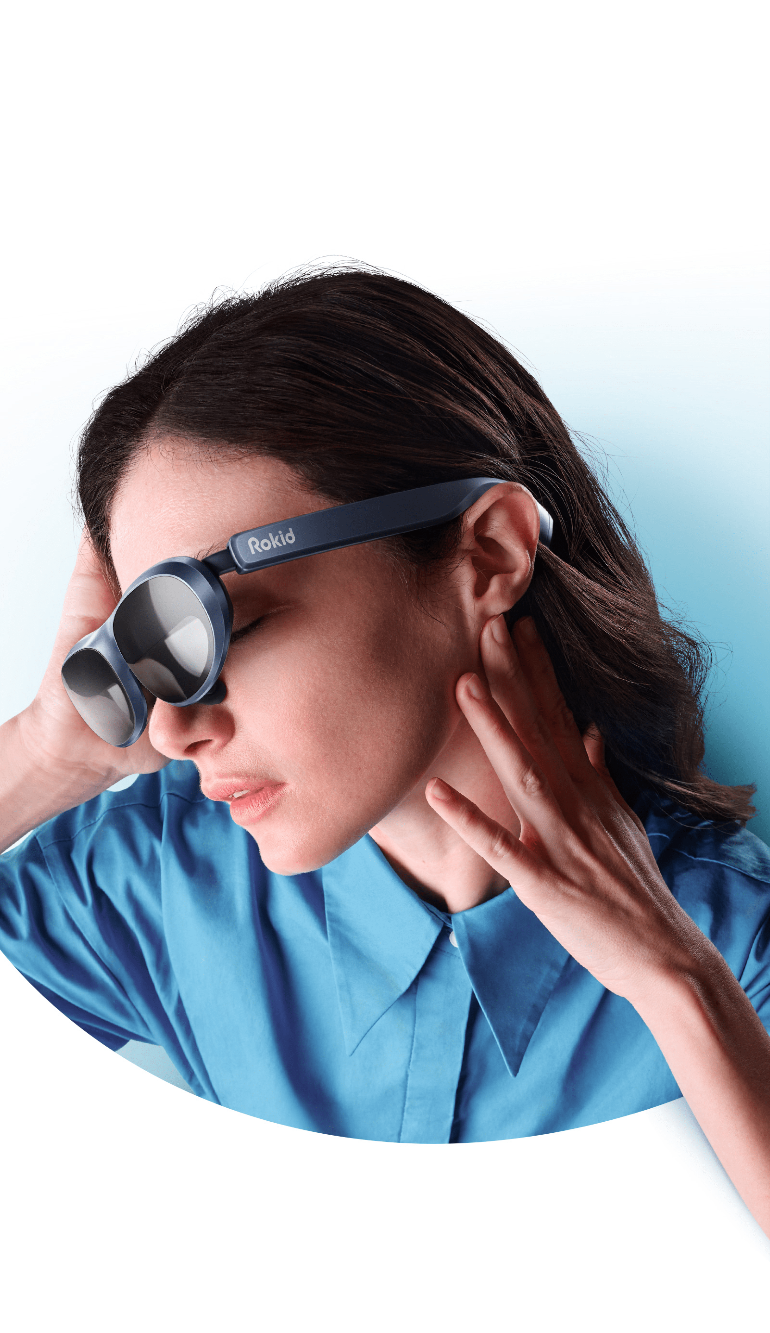 A woman in blue t-shirt wearing Rokid MAX AR sunglasses