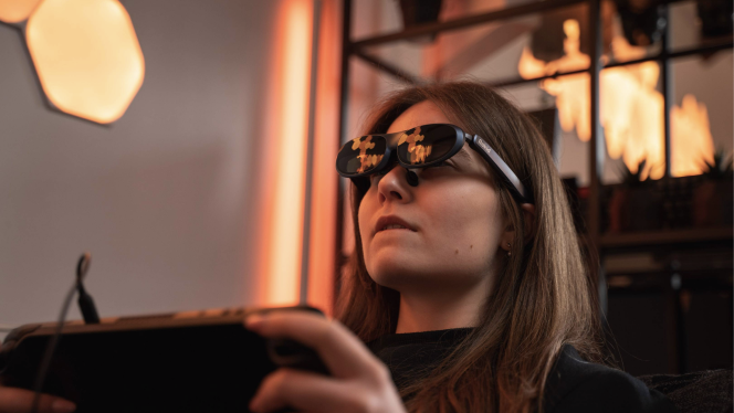 A woman wearing Rokid Max augmented reality glasses for gaming